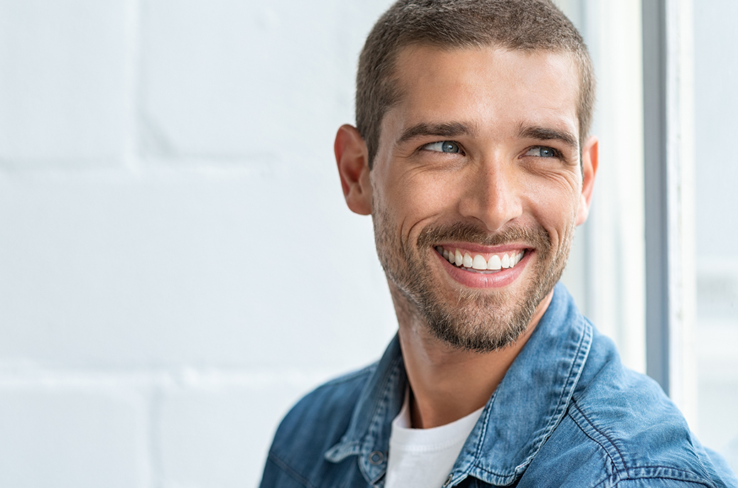 Man smiling confidently with bright white teeth